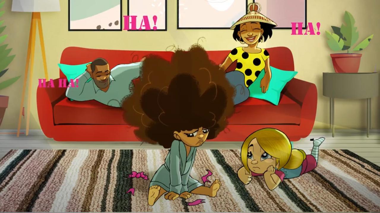 Dobo and Tomo looking at a laptop